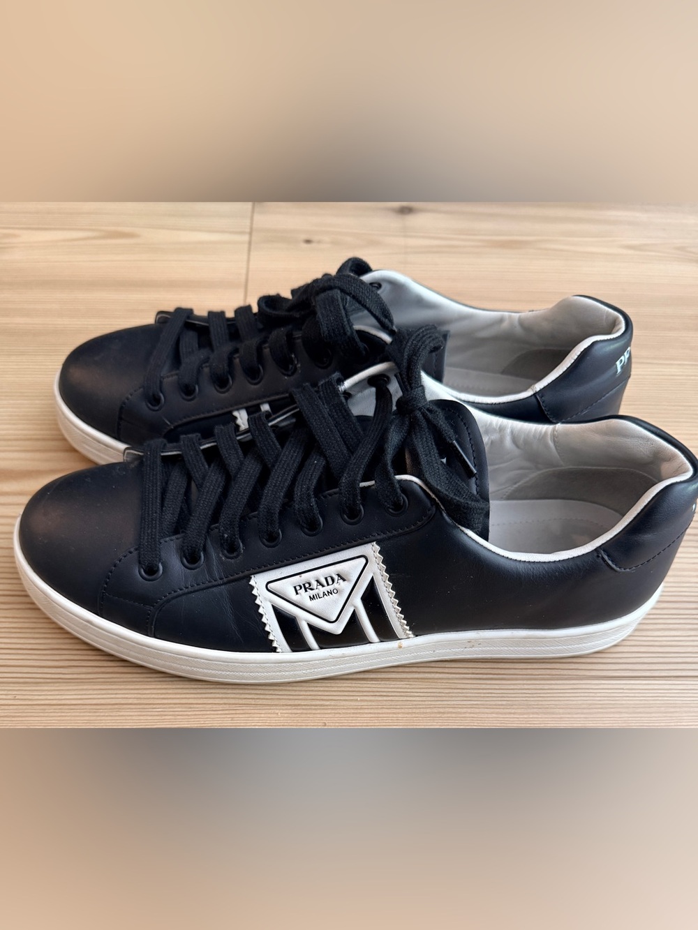 Prada Leather Sneakers – Minimalist Luxury with Signature Triangle Logo